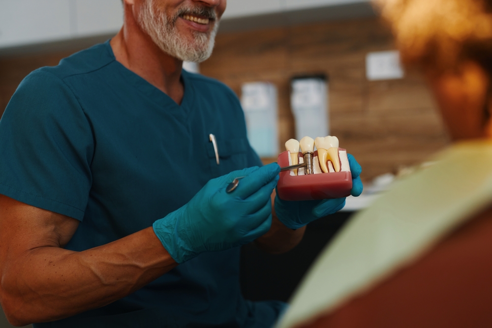Dentist and patient discussing dental implants in a Minneapolis office.